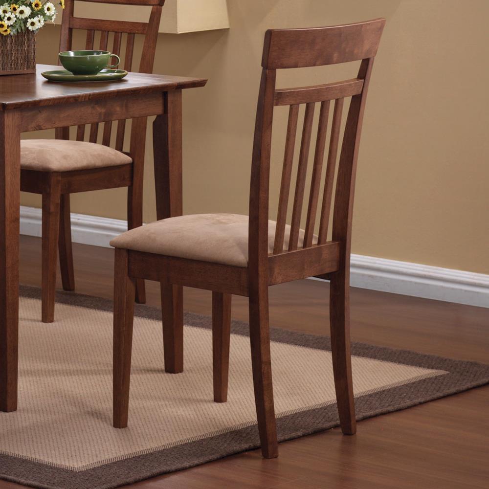 Room setting featuring chestnut rectangular dining table and tan cushioned mission chairs