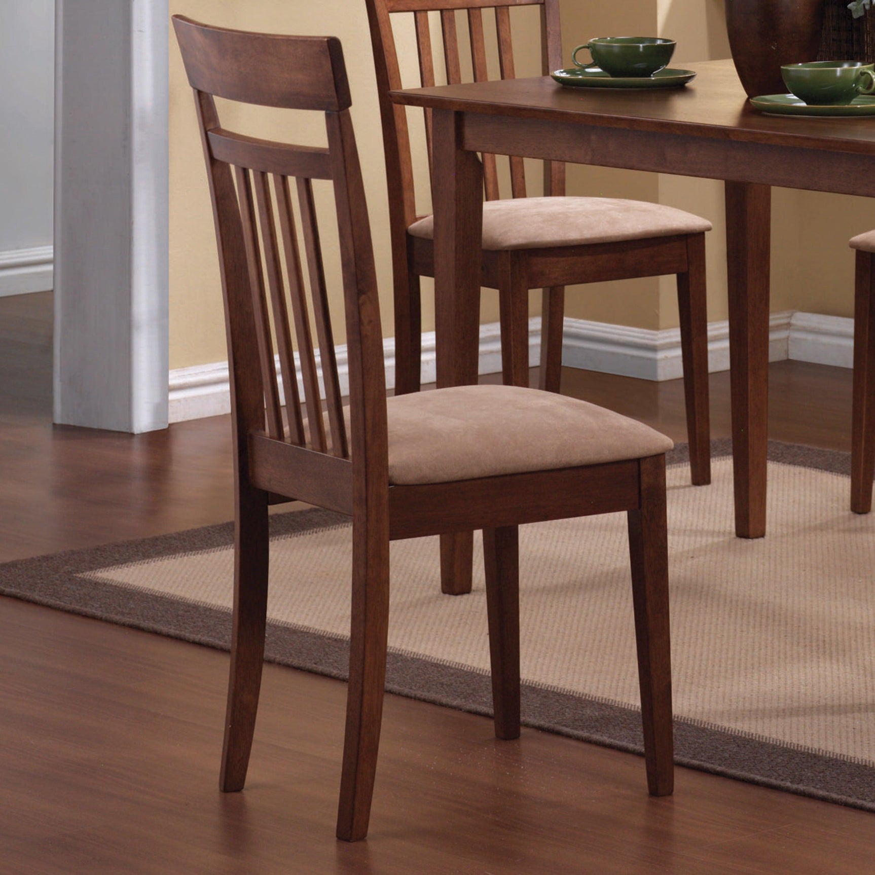 Close-up detail of chair upholstery and wood finish in chestnut set