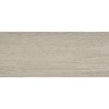 Close-up of cream faux wood veneer and tufted fabric headboard