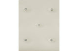 Close-up of white faux leather tufted headboard