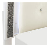 Close-up of button-tufted faux leather headboard with LED lighting