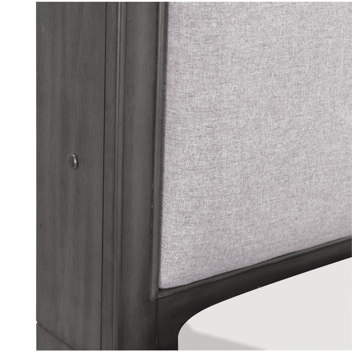 Close-up of textured pebble gray fabric upholstery on headboard