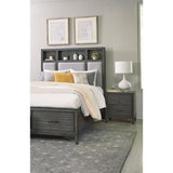 Dark bronze hardware detail on footboard drawers