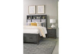 Side view of bed showing fabric upholstery and storage