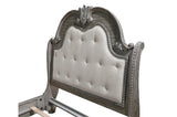 close side view of gray upholstered headboard