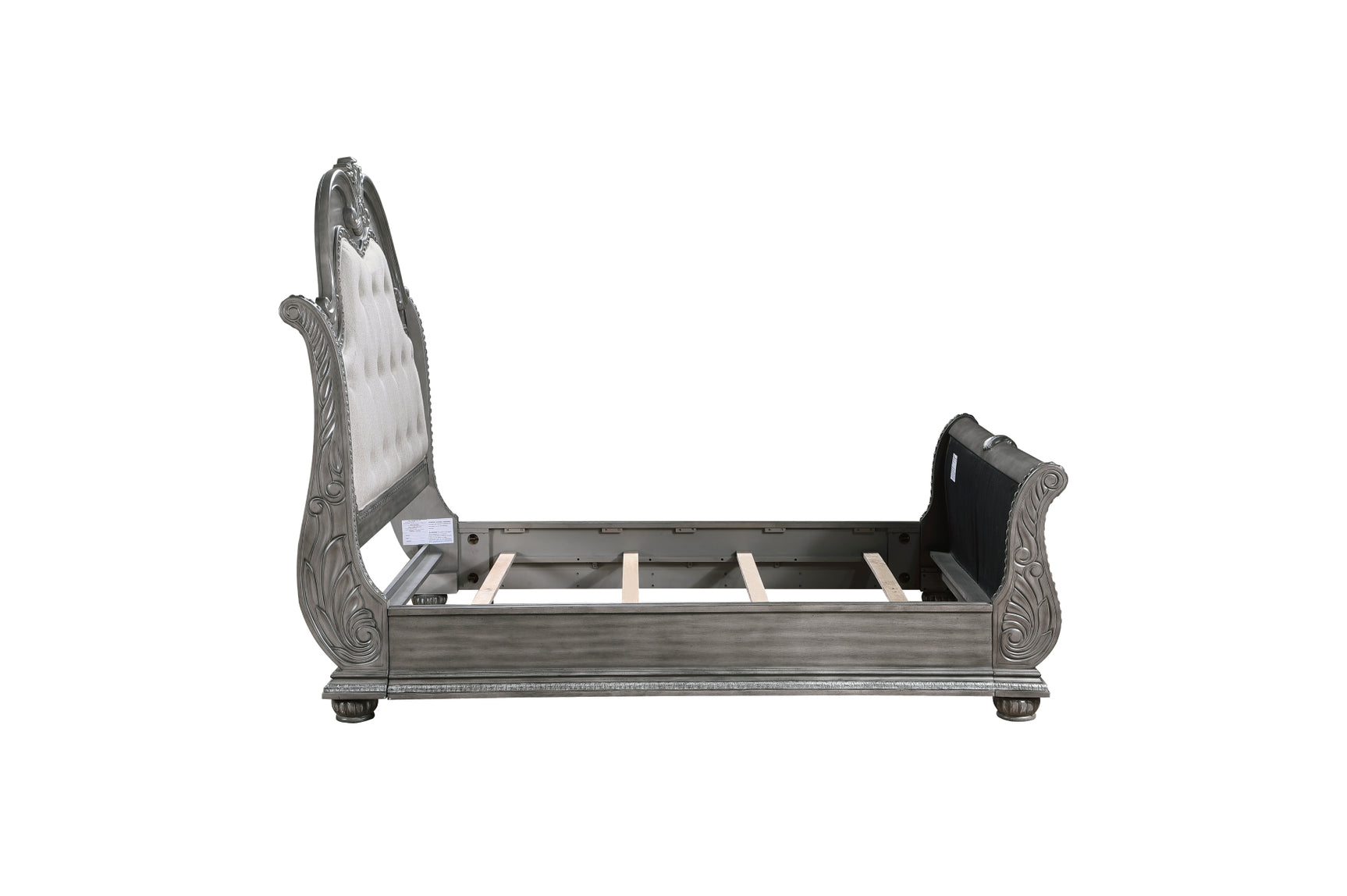 angled view of sleigh style upholstered bed