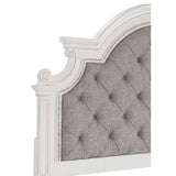 Close-up of button tufted gray fabric headboard on Baylesford queen bed