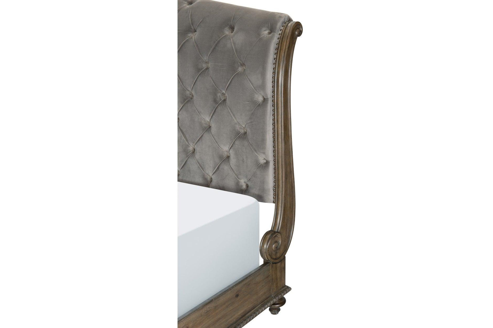 detail of tufted headboard and nailhead trim on Rachelle bed