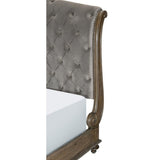 Close-up of button tufting and nailhead trim on Rachelle sleigh bed