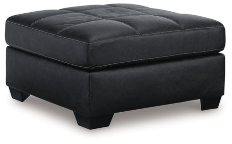 Barlin Mills Oversized Accent Ottoman in carbon faux leather angled side view
