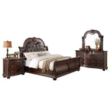 Close-up of tufted faux leather headboard on Cavalier dark cherry king sleigh bed