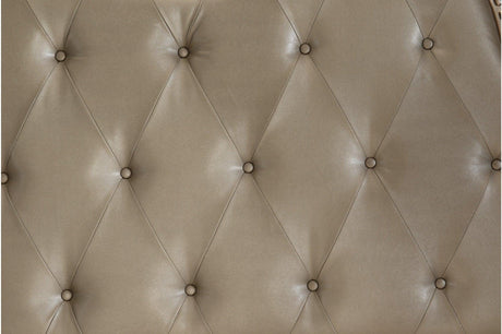 Close-up of tufted faux leather headboard