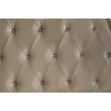 Button-tufted silver faux leather headboard close-up