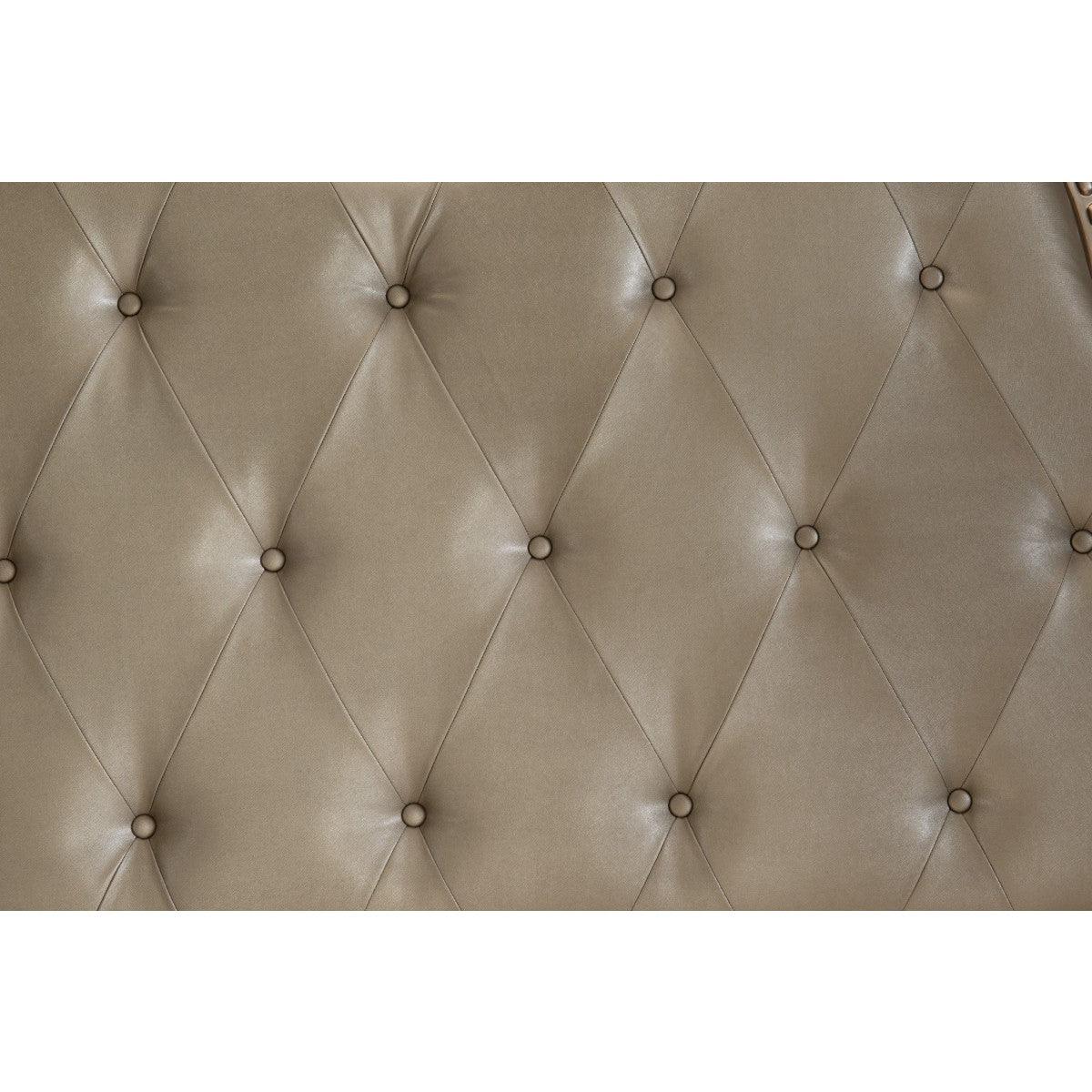 Close-up of button-tufted faux leather headboard in silver