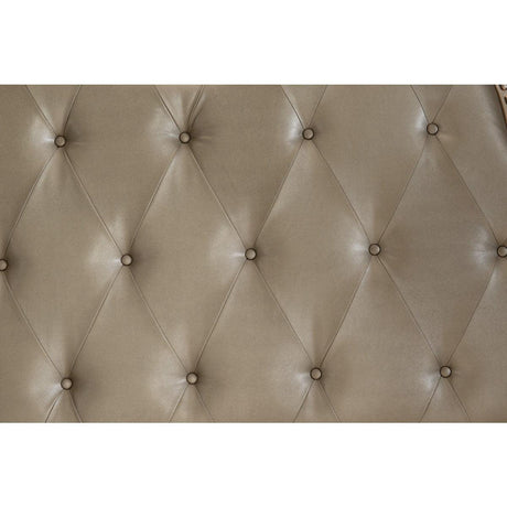 Close-up of button-tufted faux leather headboard in silver