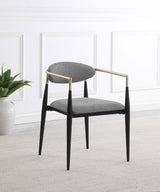 Alexis dining arm chair, side view showing black metal frame and hand-painted gold armrests