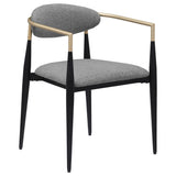 Detailed view of the padded grey fabric seat and oval backrest