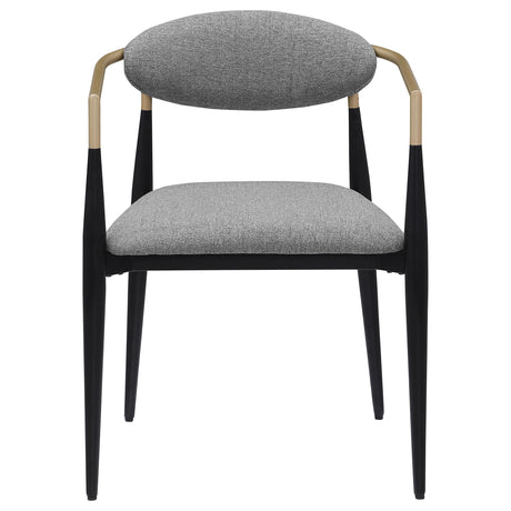 Closeup of the black powder-coated metal frame and gold armrests