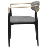 Alexis grey fabric upholstered dining arm chair with gold armrests, side view