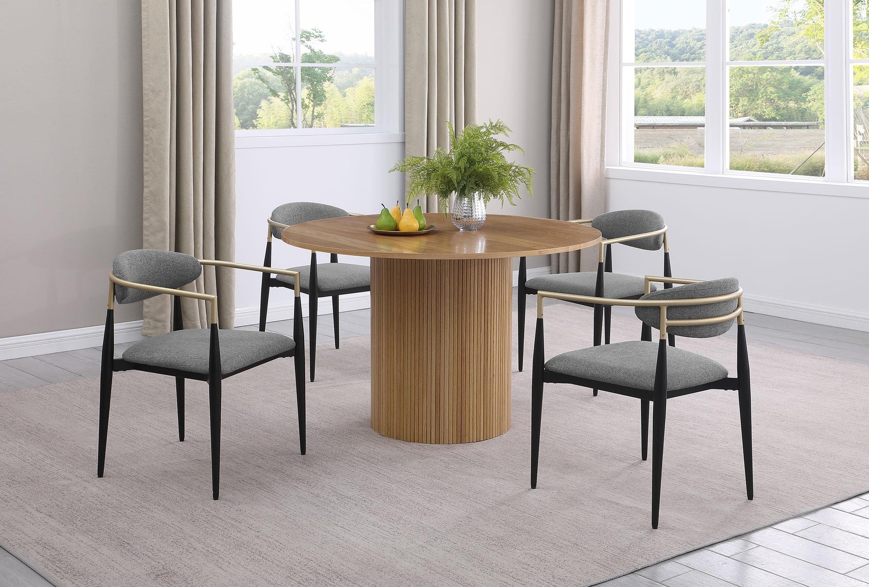 Alexis grey fabric upholstered dining arm chair with gold armrests, side view