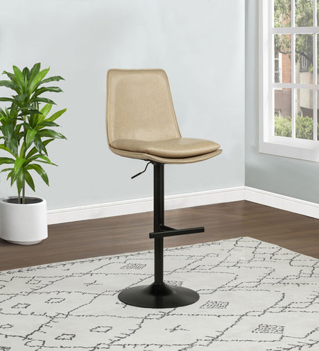 Bar stool seat close-up showing tan leatherette upholstery