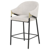 Close-up of upholstery and gold arm accent