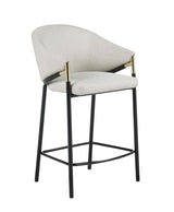 Side angle view of Chadwick stool highlighting sloped arms with gold accents