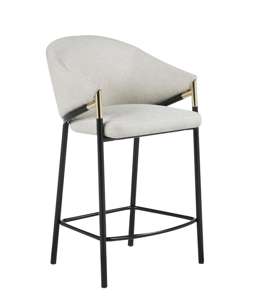 Side angle view of Chadwick stool highlighting sloped arms with gold accents