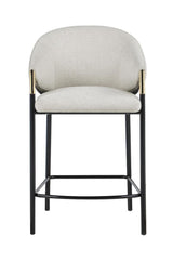 Close-up of fabric upholstery and cushioned seat on Chadwick stool