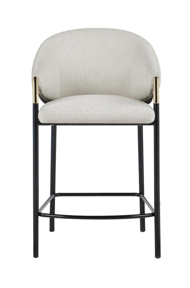 Close-up of fabric upholstery and cushioned seat on Chadwick stool