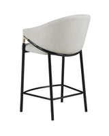 Detail of glossy black metal legs with levelers on Chadwick stool