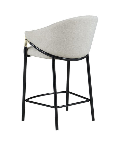 Detail of glossy black metal legs with levelers on Chadwick stool