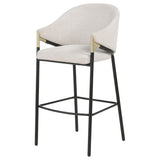 Close-up of gold accents on Chadwick bar chair arms
