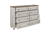Bedroom setup showing Nashville two-tone antique white and brown panel bed and dresser