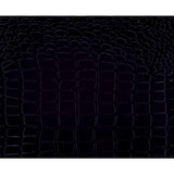 Close-up of beveled mirror trim and faux alligator embossing on headboard