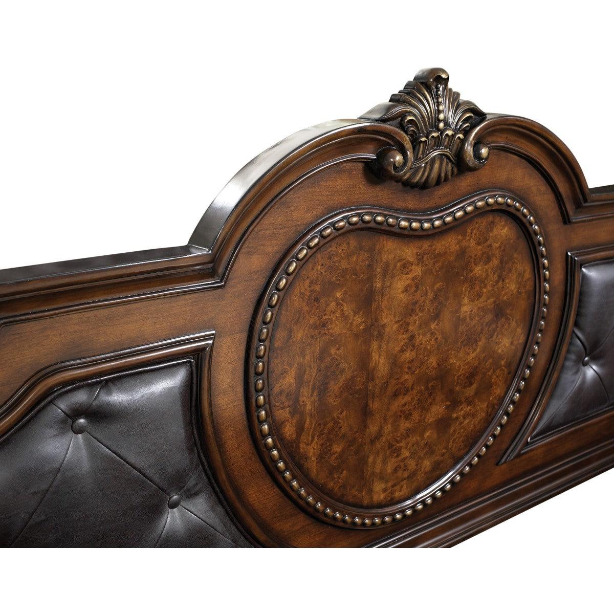 Close-up of footboard on Antoinetta Brown Cherry Veneer Queen Panel Bed