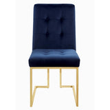 Pair of Cisco dining chairs with gold metal legs and tufted backs