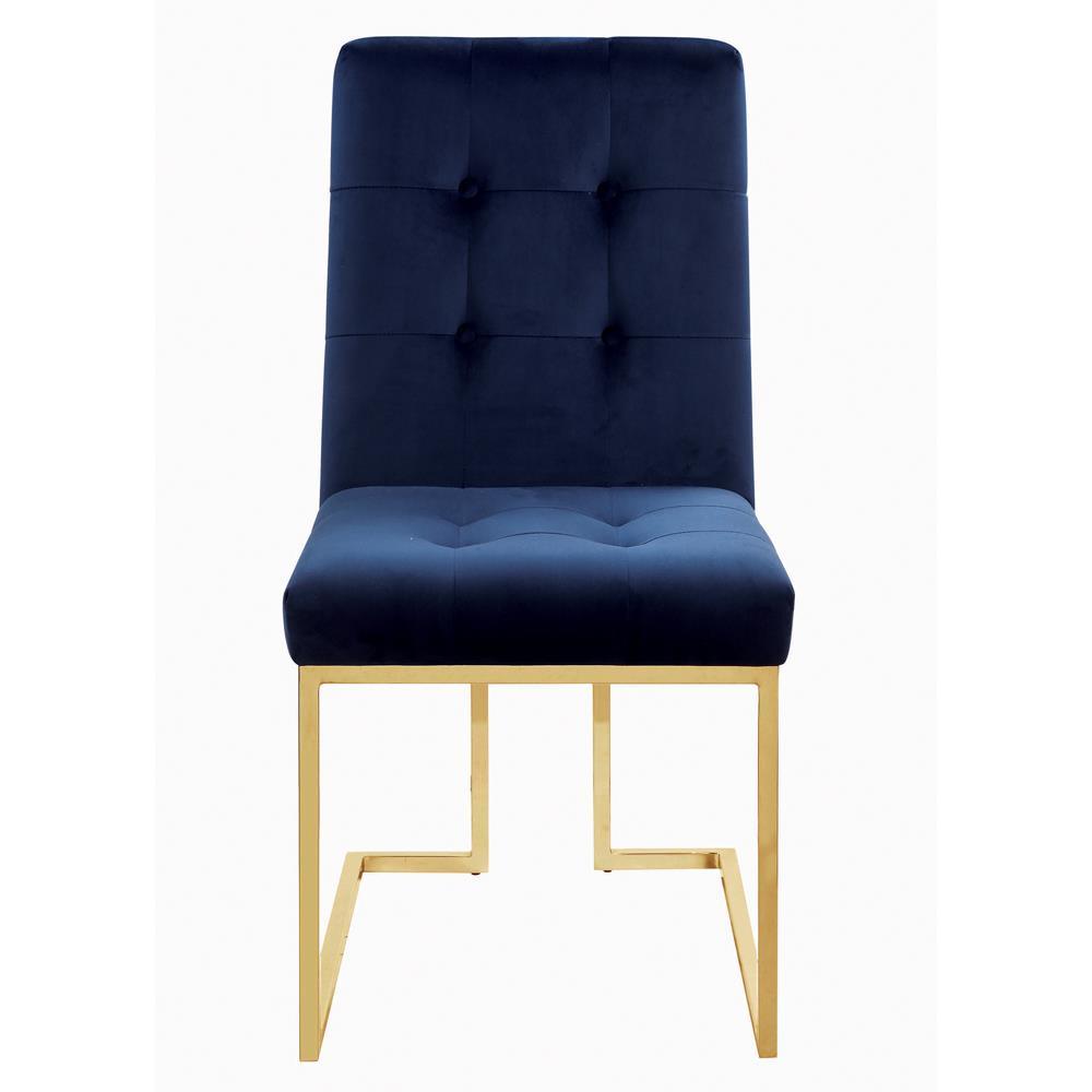 Pair of Cisco dining chairs with gold metal legs and tufted backs