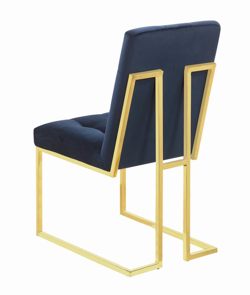 Details of gold-finished metal curved legs on Cisco dining chair