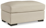 Treasure Trove Ottoman front view in almond upholstery