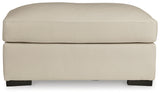 Treasure Trove Ottoman head-on view almond leather cushion