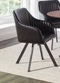 Front angle of tufted sloped arm swivel dining chair in black leatherette
