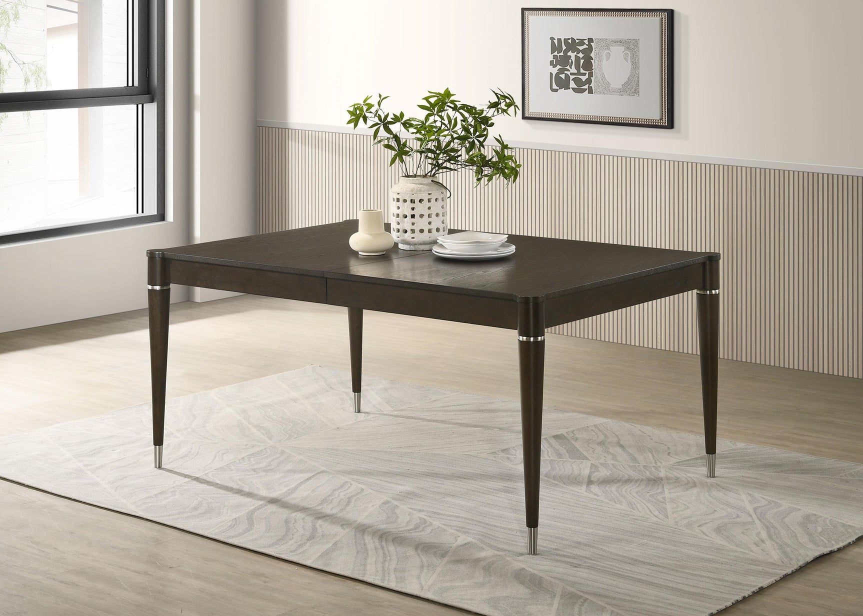 Metal-capped tapered leg and metallic accents detail on Reseda table