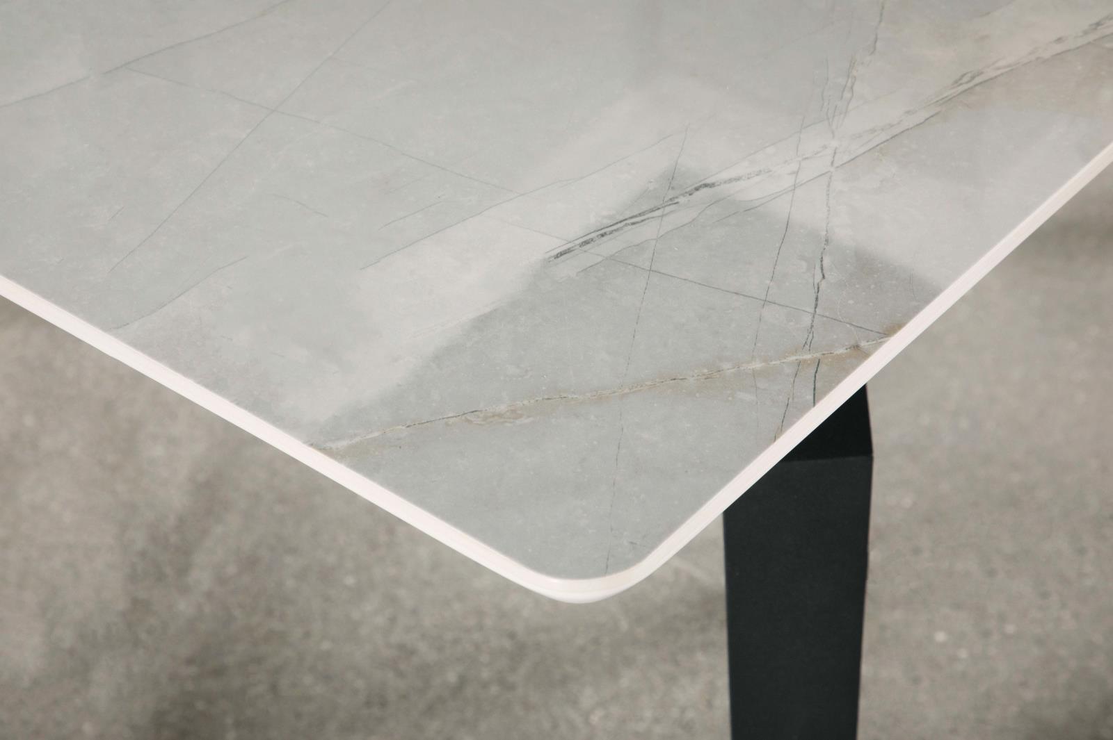Mina Dining Table with chairs in showroom