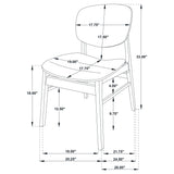 Two chairs pulled close to dining table in bright room