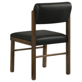Kehoe upholstered dining side chair in black leatherette from front right angle
