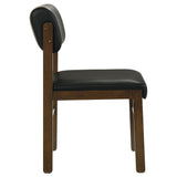 Kehoe upholstered dining side chair in black leatherette from front right angle