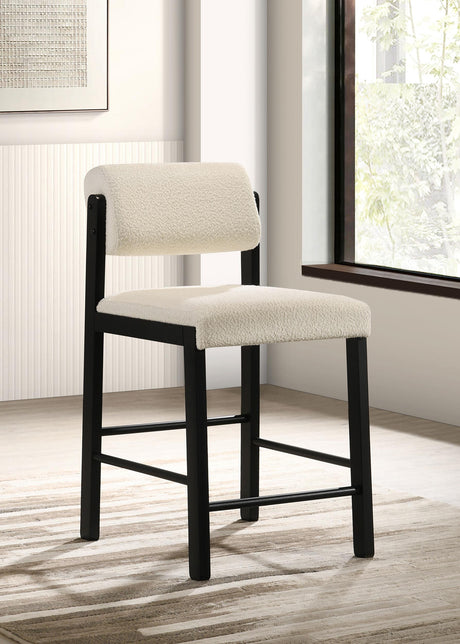 Side view of Kehoe cream upholstered counter height chair with footrest