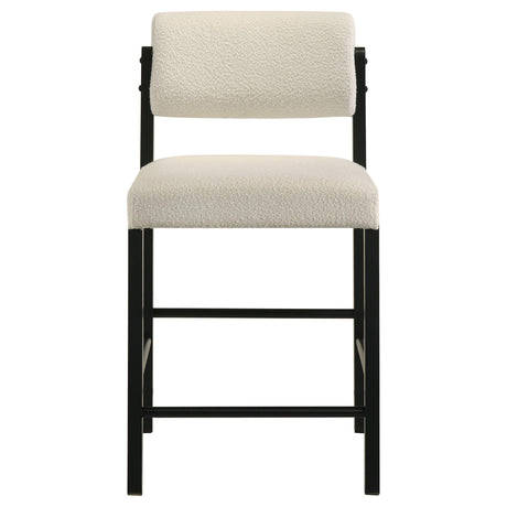 Close-up of cream polyester fabric upholstery on Kehoe chair