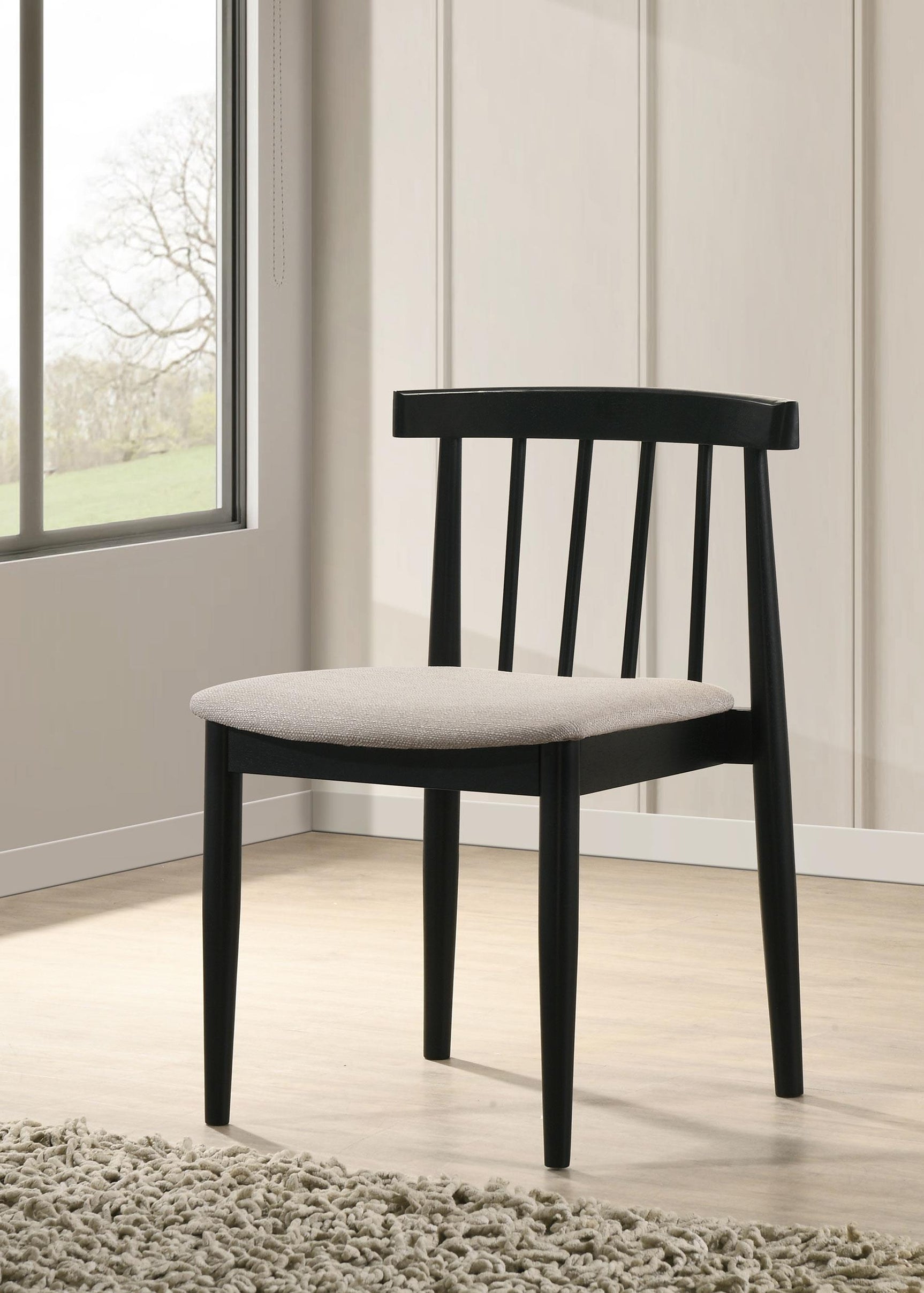 Side angle view of Cullen dining chair showing spindle back and tapered legs